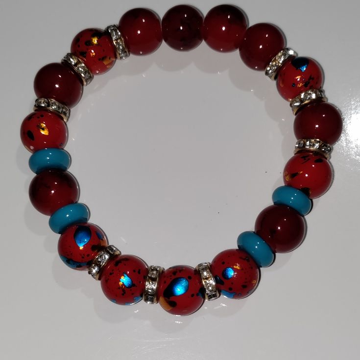 Red, Blue And Gold Bracelet Made With Glass Beads. Lava Rock Jewelry, Whimsical Necklace, Fork Bracelet, Toggle Clasp Bracelet, Turquoise Statement Necklace, Rock Jewelry, Hand Crafted Jewelry, Jewelry Bracelet, Crafted Jewelry