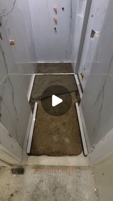 an open door with dirt on the floor