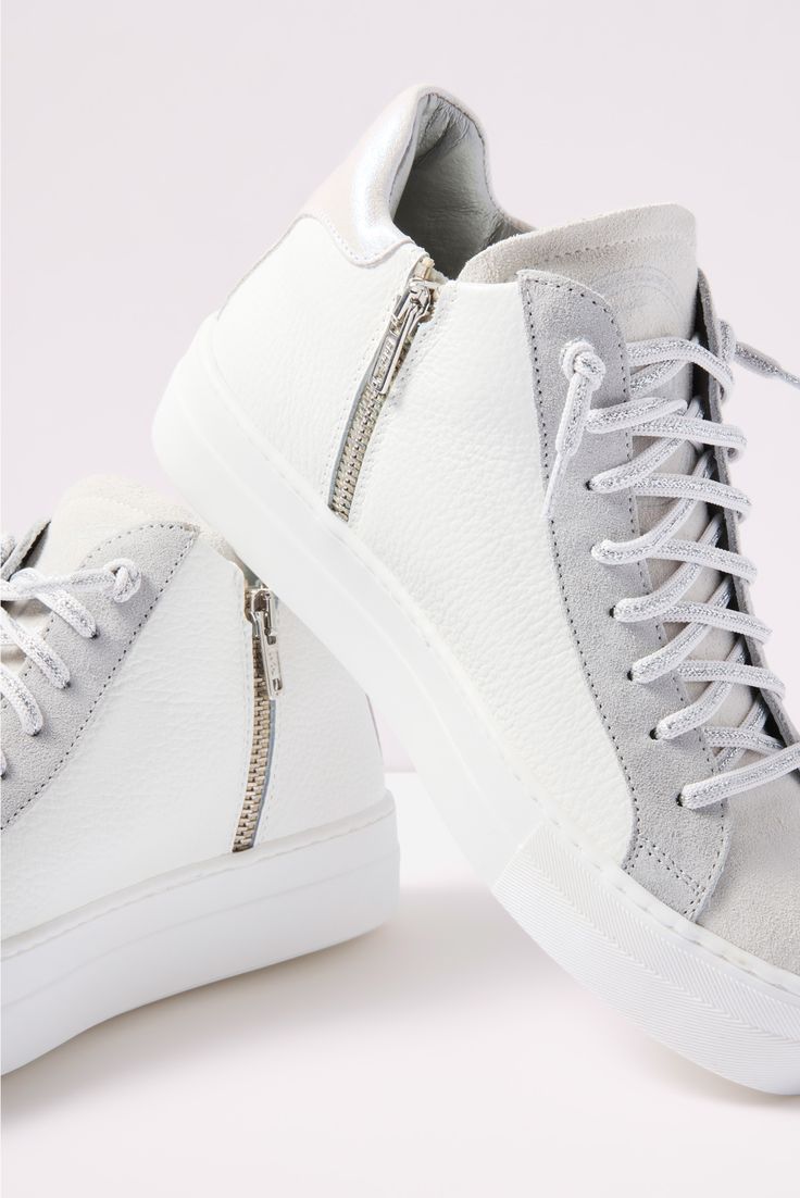 Step out in style with these high-top sneakers by P448, finished with an inside zipper closure, perforated logo detail, and iridescent heel tab for an eye-catching touch. Each pair of P448 sneakers is crafted to maximize comfort, while the unexpected color combinations, textures, and patterns add a unique flair. All P448 sneakers are designed and made in Italy. High-top Sneakers With Zipper For Streetwear, High-top Sneakers With Zipper Closure For Streetwear, Sporty High-top Sneakers With Zipper For Streetwear, Leather Sneakers With Zipper For Streetwear, Sporty Leather High-top Sneakers With Zipper, White High-top Sneakers With Zipper, Sporty High-top Sneakers With Zipper Closure, Sporty High-top Sneakers With Zipper, Modern High-top Sneakers With Perforations