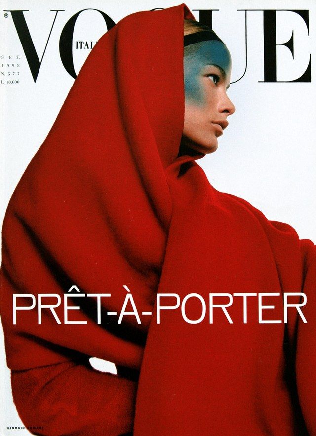 a woman in a red hoodie on the cover of a magazine, with her head covered by a scarf