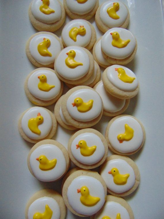 there are many decorated cookies in the shape of ducks