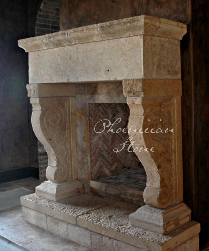 an old stone fireplace in the corner of a room