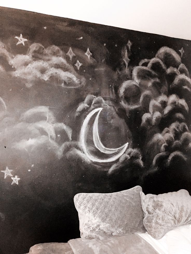 a black and white photo of a night sky with stars and the moon painted on it