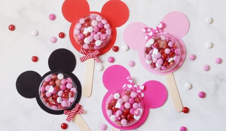 mickey and minnie mouse cupcake toppers with candy on them for valentine's day