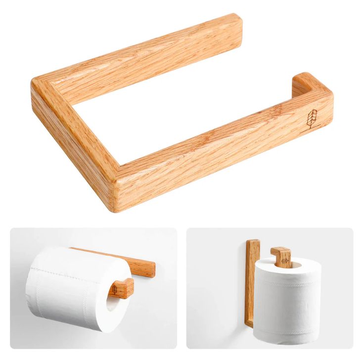 the wooden toilet paper holder is next to two rolls of toilet paper