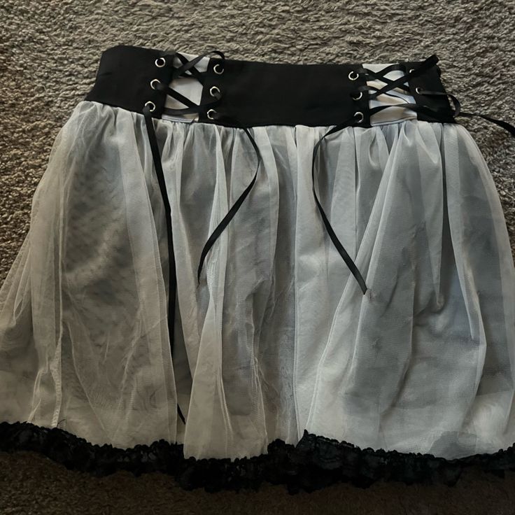 Black And White Goth/ Punk Lace Skirt. Barely Worn, Maybe Two Time, Looks Brand New. Black Underlay With White Lace Over The Top. Size Medium All Items Come From A Smoke Free Distributor Spring Alternative Style Skirt For Cosplay, Gothic Pleated Skirt For Alternative Fashion, Edgy Skirt For Halloween Costume Party, Black Mini Skirt For Costume Party, Emo Skirt For Alternative Fashion, Fitted Grunge Mini Skirt For Cosplay, Grunge Mini Skirt For Cosplay, Punk Skirt For Halloween Concert, Black Emo Mini Skirt For Cosplay