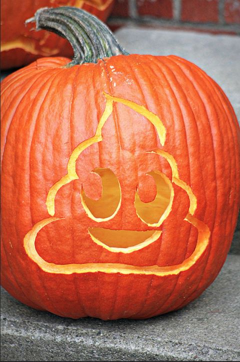 a pumpkin with a smiley face carved into it's side and another pumpkin in the background