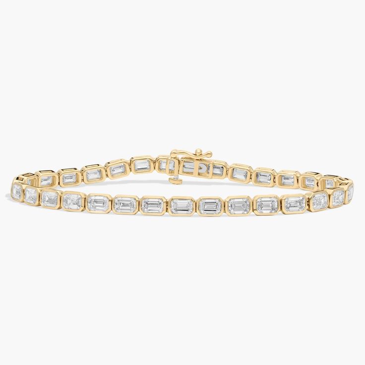 Timelessly luxurious and elegant, this classic tennis bracelet features 12 ct. tw. of lab grown diamonds shimmering along its length. The emerald-cut stones are beautifully held in bezel settings in the lustrous 14k yellow gold design. Multi Shape Tennis Bracelet, Emerald Cut Tennis Bracelet, Pearl Jewelry Gift, Pearl Bracelet Gold, Topaz Bracelet, Platinum Rose Gold, Gold Rings Fashion, Gold Pearl Necklace, Ladies Diamond Rings