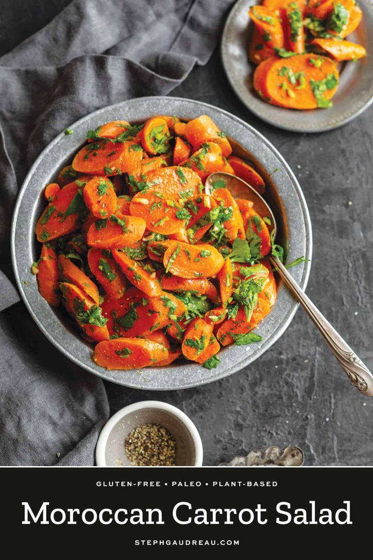 two bowls filled with carrots and herbs