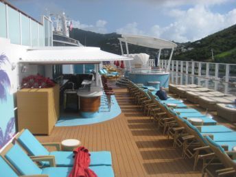 lounge chairs on the deck of a cruise ship