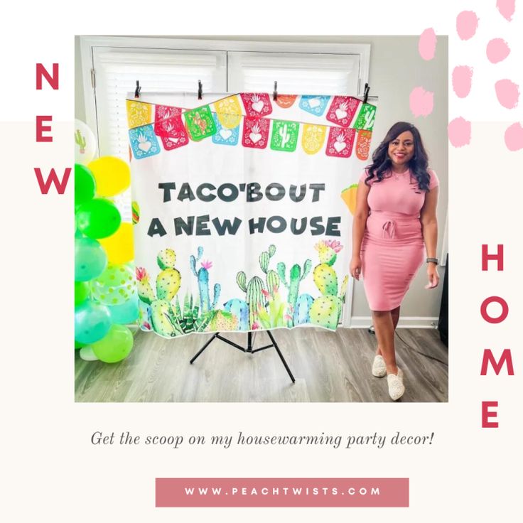 a woman standing in front of a sign that says taco about a new house