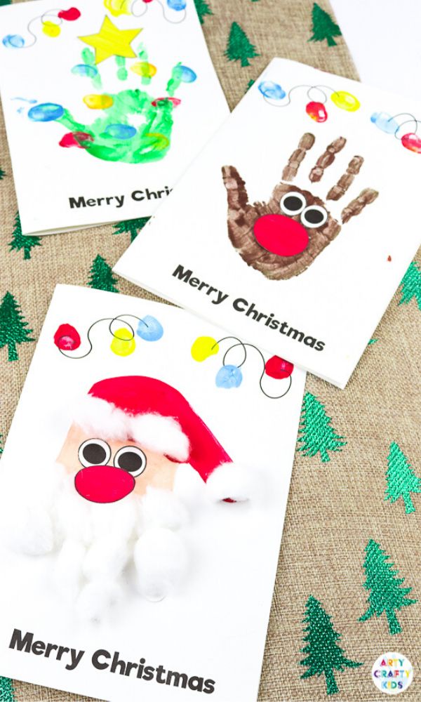 three christmas cards with handprints on them and santa claus's hat in the middle