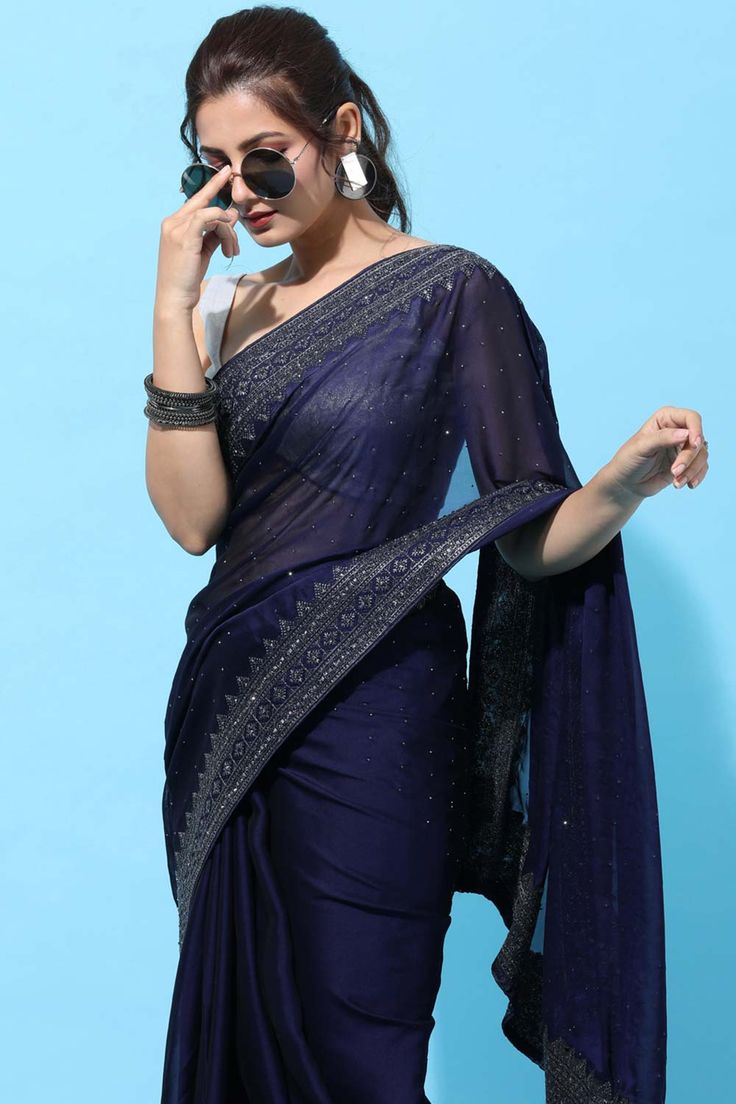 Product Features: Color: Navy Blue Fabric: Art Silk Work: Stone Embroidered Saree Length: 5.5 Meter Blouse Length: 0.80 Meter Style: Traditional Occasion: Festive Wash Care: Dry Clean Blouse Disclaimer: The last image gives a detailed look of the blouse piece that comes with this saree (The model is wearing a blouse from our in-house wardrobe) Disclaimer: There will be slight difference in digital to actual image Navy Blue Saree, One Minute Saree, Indian Designer Sarees, Plain Saree, Saree Blouse Patterns, Readymade Saree, Embroidered Saree, Ready To Wear Saree, Designer Saree Blouse Patterns