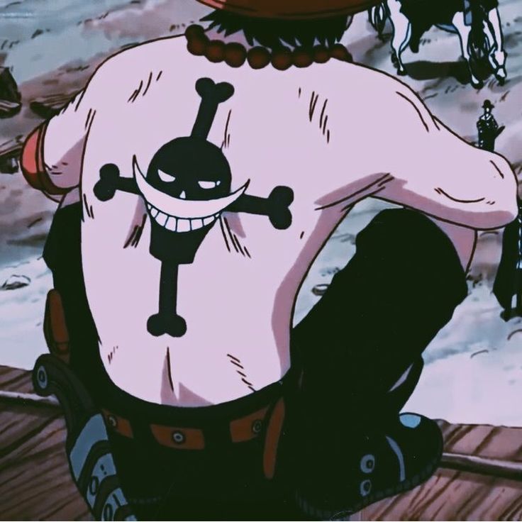 the back of a person wearing a pink shirt with a black skull and crossbones on it