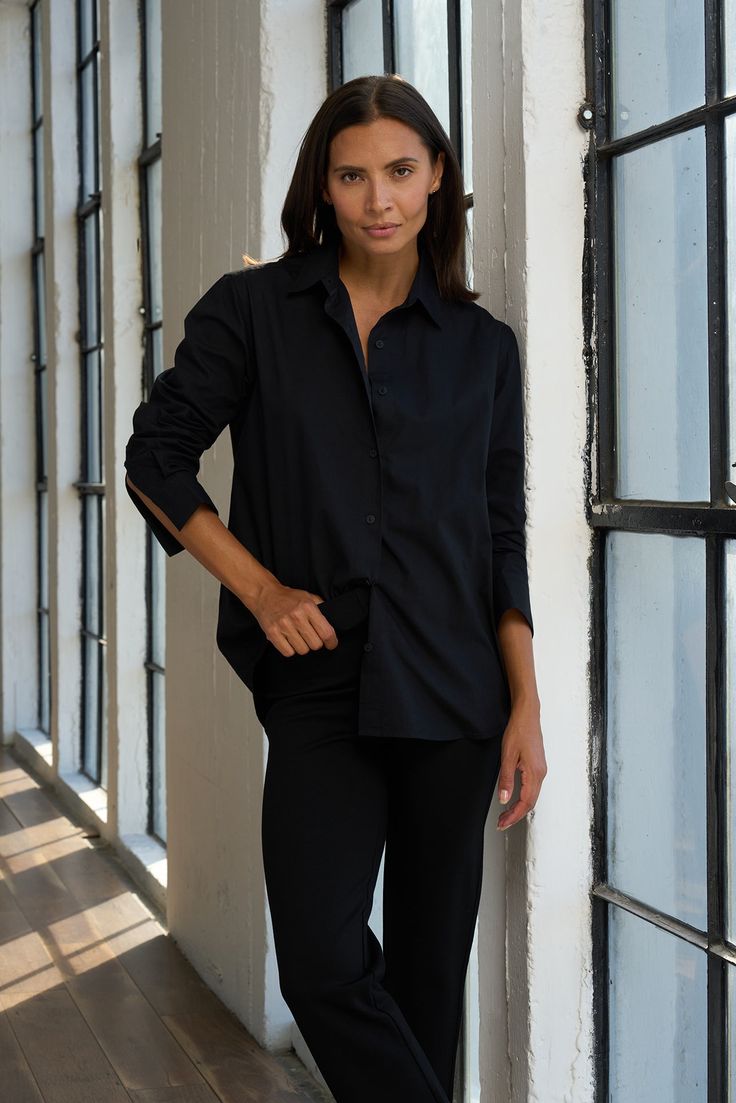 Simple, elegant, and versatile, this cotton shirt is a must-have for every closet. Dress it up or down with your favorite pant for endless wear. ✓ Machine Washable ✓ Office Ready ✓ Perfect for Layering ✓ Day to Night DETAILS Breathable lightweight cotton Button cuff sleeves Shirttail hem FIT Relaxed fit True to size Model is 5'8" and wears size S MEASUREMENTS Length from shoulder (back): 30" FABRIC + CARE 100% cotton Machine wash cold. Do not bleach. Tumble dry low. Can be dry cleaned. Cool iron Fitted Tunic, Simple Elegant, Tunic Length, Cuff Sleeves, Wardrobe Staples, Fabric Care, Cotton Shirt, Black Shirt, Must Haves