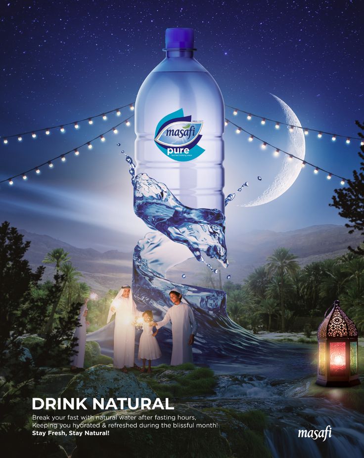 a water bottle advertisement with people standing in front of it and the caption drink natural