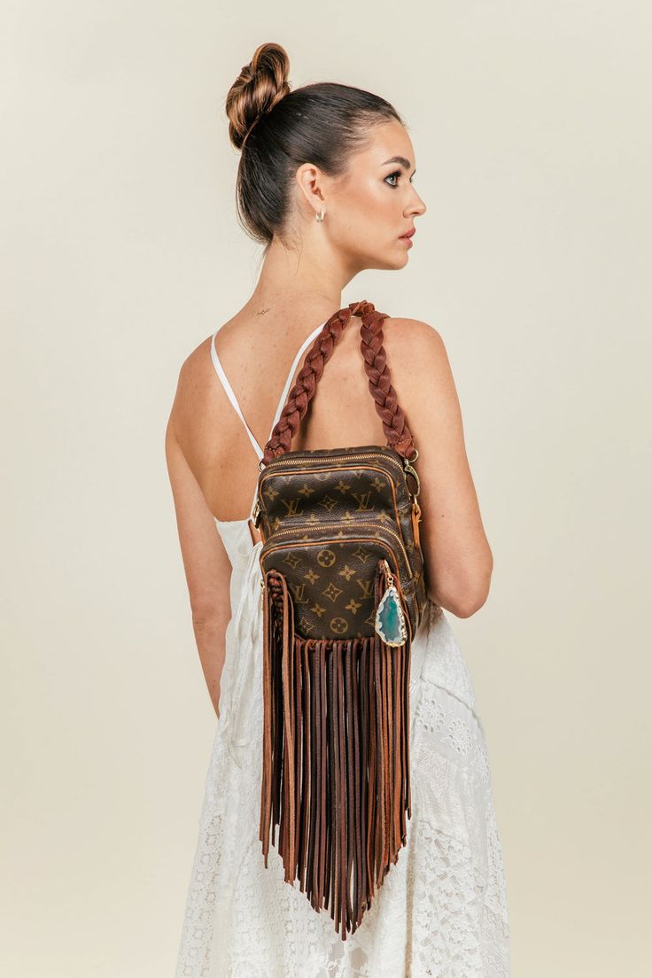 Compact shoulder bag, versatile and cleverly designed, with an exterior front pocket perfect for your essentials. The Side Kick is an ideal go-everywhere bag that is lightweight and roomy yet emanates effortless Boho-chic. Dimensions: Width: 6.5" Height: 8.5" Depth: 3.5" Fringe: 13" Strap Length: 47" Strap Type: 3-Strand Flat Braided, Interchangeable Guarantee Of Authenticity We put every bag through a multi-point, brand-specific authentication process by our team of luxury experts. Our reputati Travel Crossbody Shoulder Bag With Removable Pouch, Travel Shoulder Bag With Removable Pouch, Crossbody Style, On-the-go Camera Shoulder Bag With Removable Pouch, Luxury Shoulder Bag With Zipper Pocket For Errands, Travel Crossbody Hobo Bag With Cell Phone Pocket, Travel Hobo Bag With Cell Phone Pocket, Crossbody Style, Travel Hobo Bag With Cell Phone Pocket, Crossbody Shoulder Bag With Cell Phone Pocket For Errands, Chic Shoulder Bag Backpack With Zipper Pocket