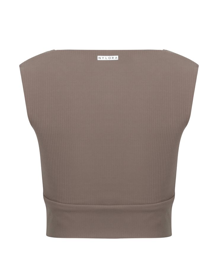 DETAILS: Color: Mocha Nylora's signature 4-way stretch fabric Built-in bra with removable padding Square neckline 77% Nylon, 23% Spandex Machine wash SIZE & FIT: Fits true to size Length: 14 3/4" Bust: 14" Bottom: 12 1/4" Versatile Seamless Elastane Crop Top, Versatile Stretch Tops With Removable Bra Pads, Seamless Elastane Crop Top, Fitted Tops With Removable Bra Pads, Versatile Fitted Crop Top With Removable Bra Pads, Fitted Versatile Crop Top With Removable Bra Pads, Fitted Brown Athleisure Top, Fitted Brown Top For Yoga, Fitted Beige Sports Bra With Removable Pads