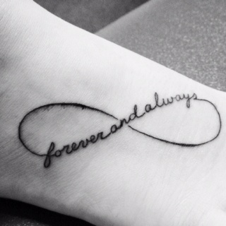 a foot with a tattoo on it that says,'forever'in cursive writing