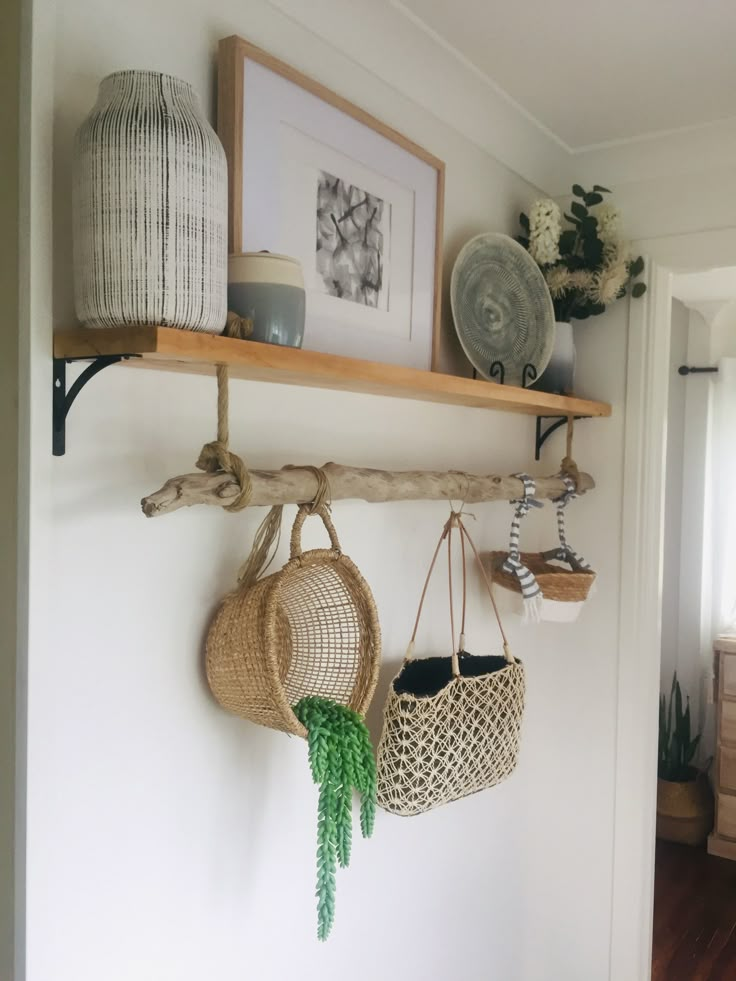 two baskets are hanging on the wall