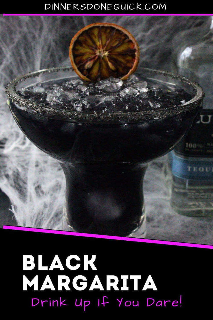 the black margarita drink is garnished with an orange slice