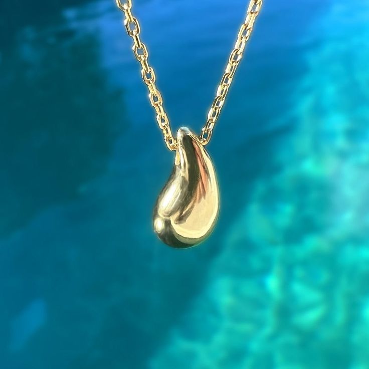 Showcase you love of water with our stunning and modern Wai Raindrop pendant. Water is life in Hawaii and this beautifully designed pendant is sure to add elegance and sophistication to any outfit. .925 Sterling Silver Approx. 1/2" Tall Available in 14K Gold Plated or Silver Includes 18" Adjustable chain w/1" extension Modern Teardrop Necklace For Anniversary, Teardrop Shaped Jewelry With Shiny Finish For Anniversary, Minimalist Polished Drop Jewelry, Everyday Teardrop Jewelry With Shiny Finish, Minimalist Drop Jewelry With Polished Finish, Tarnish Resistant Drop Jewelry For Anniversary, 14k Gold Teardrop Jewelry With Polished Finish, White Gold Drop Jewelry With Shiny Finish, Anniversary Drop Jewelry With Polished Finish