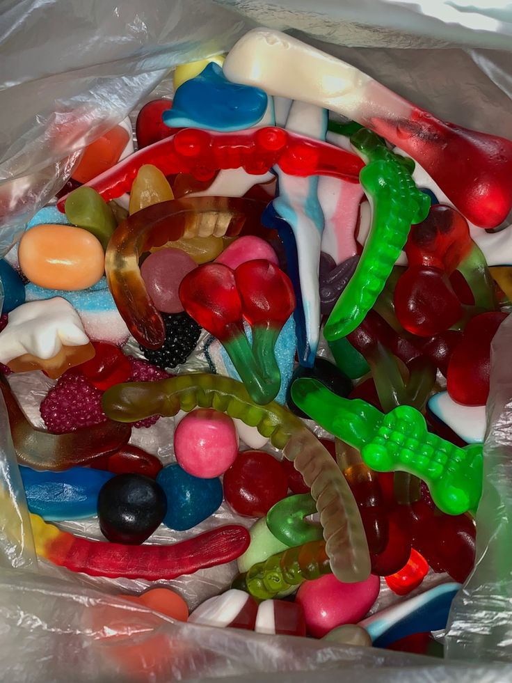 a bag filled with lots of different colored gummy bears