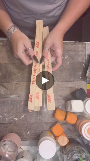 a person is making something out of some kind of paper and cardboard with their hands