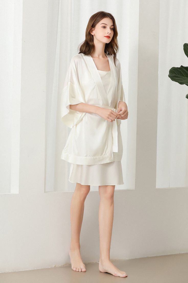 Fabric: 92% 19 Momme mulberry silk 8% Spandex Color: White Care: Hand wash or dry clean Silk robe dressing gown. Dolman sleeves. Shawl collar. Dropped shoulders. Open front. Fastens with a matching belt. Closing edge. Unlined. This wrap is designed with kimono proportions, but with a more modern short length. Silk Kimono Robe, Silk Robe, Grad Dresses, Home Dress, Silk Kimono, Dressing Gown, Dress Ideas, Sleepwear Women, Mulberry Silk