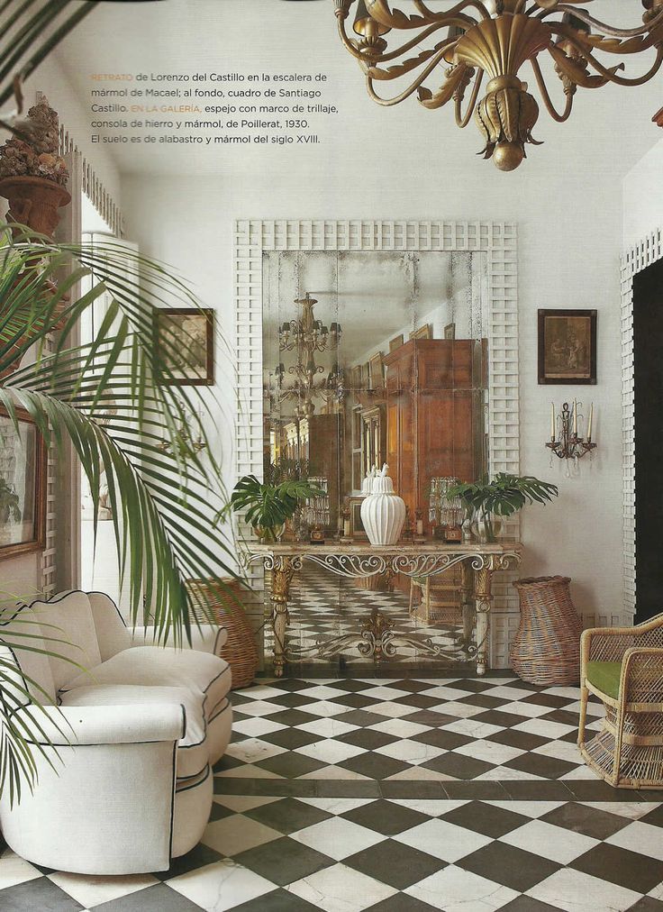 a living room filled with furniture and a chandelier