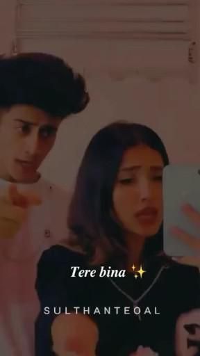 two people standing next to each other looking at something on a cell phone with the caption tere bina sulhanteogal