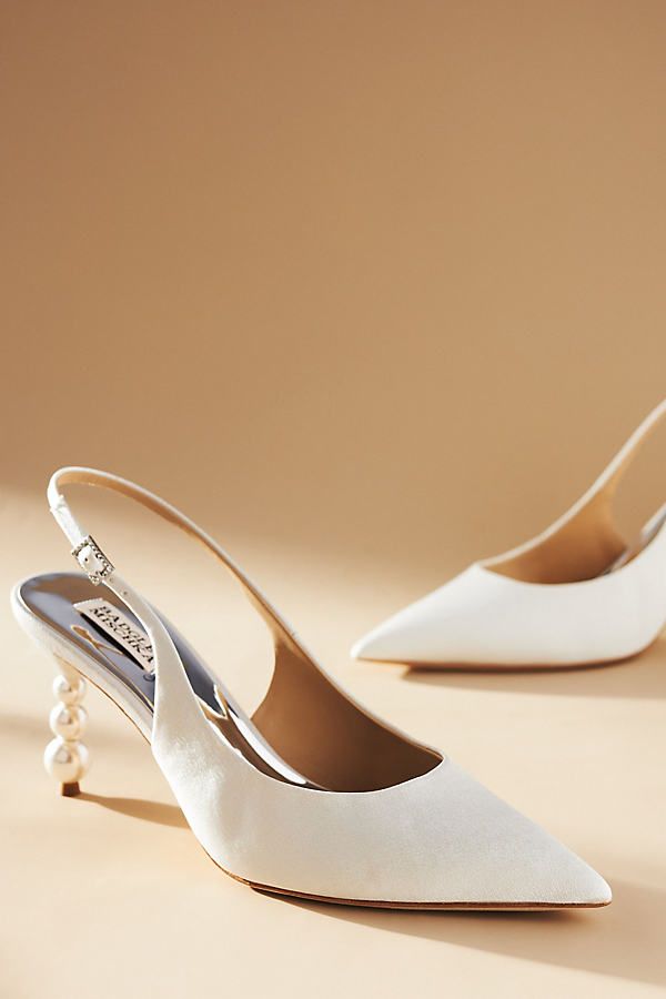 The Badgley Mischka Beatrix Slingback Pumps, adorned with an eye-catching stacked bubble heel, are ready to carry you through your special day in elegant style. | Beatrix Slingback Pumps by Badgley Mischka in White, Women's, Size: 7, Leather/Plastic/Wood at Anthropologie Badgley Mischka Bridal Shoes, Classic Wedding Shoes, Fall Wedding Shoes, White Heels Wedding, Elegant Wedding Shoes, Bridal Shoes Low Heel, White Bridal Shoes, Wedding Shoes Low Heel, Bridal Pumps