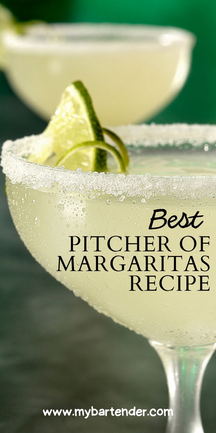 the best pitcher of margaritas recipe in a martini glass with lime garnish