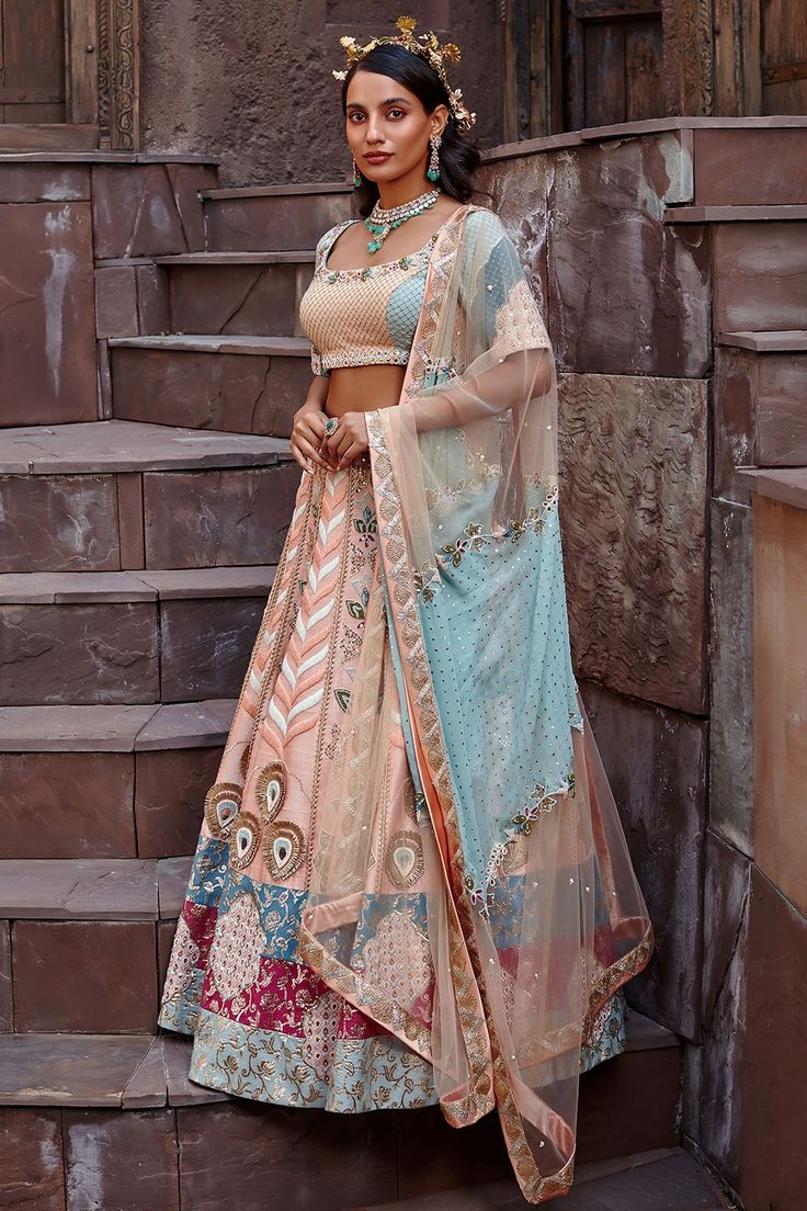 Peach blossom lehenga with zardozi embroidery, bead work and brocade trims at the hem. Comes with blouse and dupatta.
Component: 3
Pattern: Embroidery
Type Of Work: Zardozi and Beads
Neckline: Square
Sleeve Type: Half
Fabric: Pure Raw Silk, Georgette and Chinon Chiffon 
Color: Peach
Other Details: 
Dual tone dupatta with embroidery
Back cutout
Occasion: Wedding - Aza Fashions Raw Silk Embroidery, Embroidery Zardozi, Zardozi Embroidery, Peach Blossom, Beaded Neckline, Pattern Embroidery, Peach Blossoms, Silk Embroidery, Bridal Lehenga