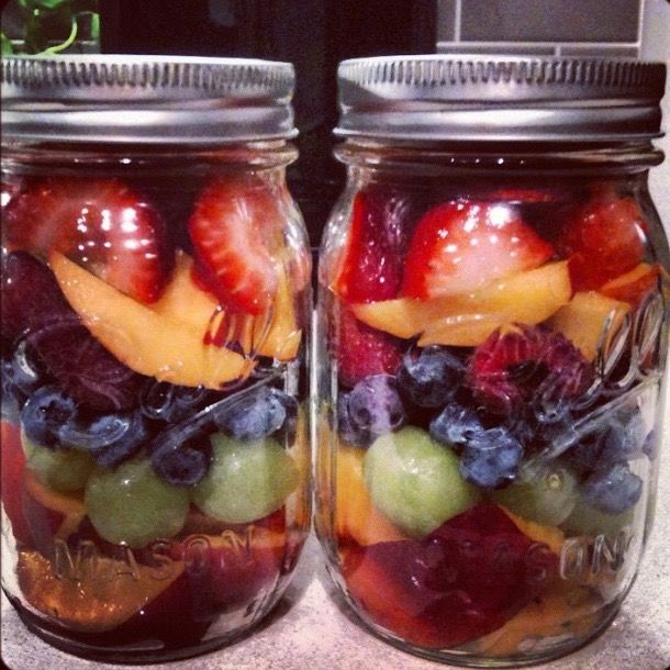 two mason jars filled with different types of fruit