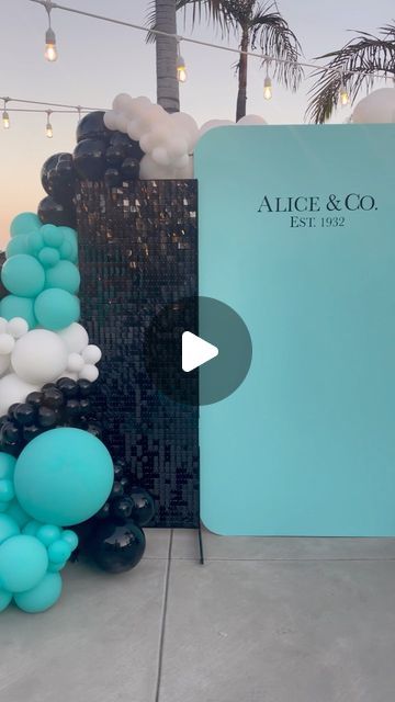 an image of balloons in front of a sign that says alice & co