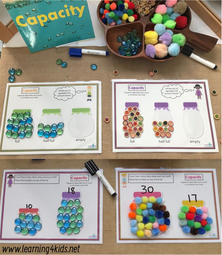 the table is full of different colored beads and numbers for counting practice with matching cards