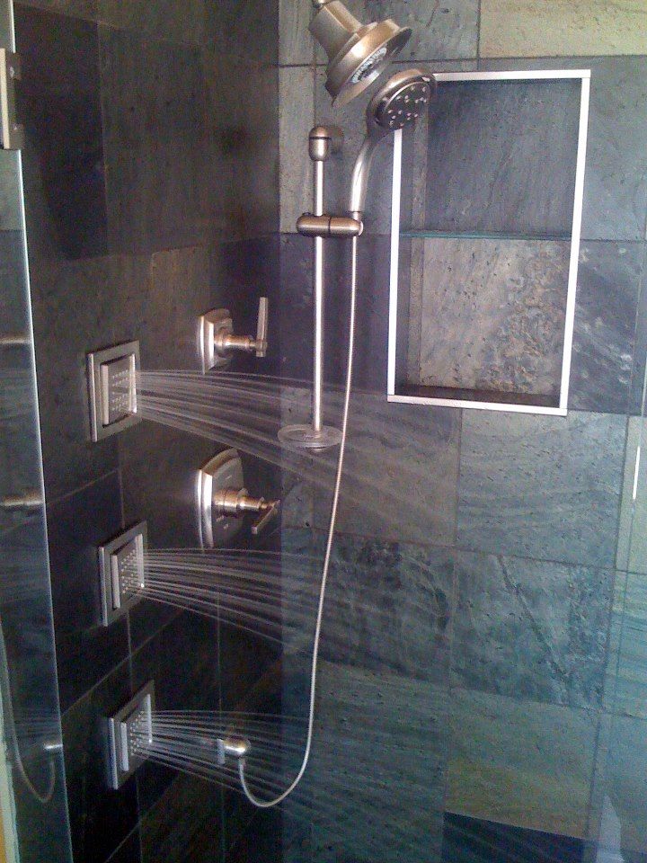 a glass shower door in a bathroom