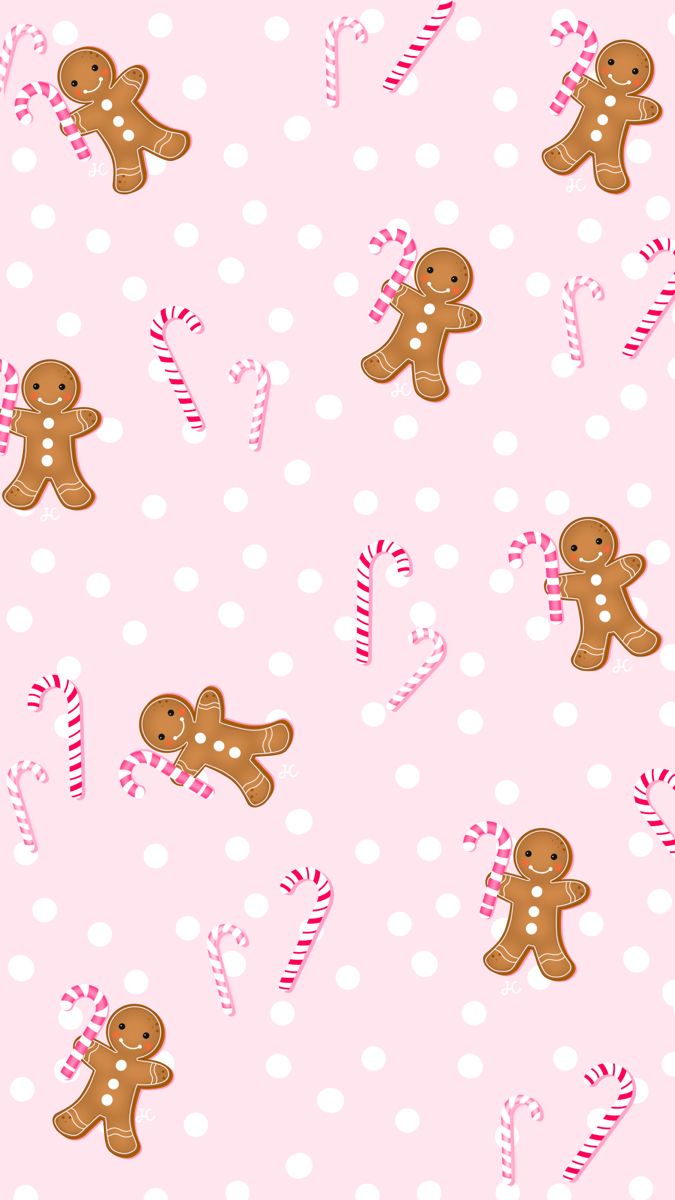 a pink background with gingerbreads and candy canes