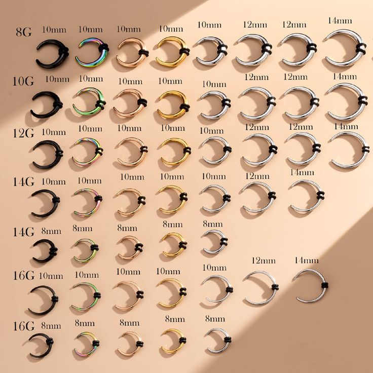 the different sizes and shapes of earrings are shown on a table with measurements for each pair