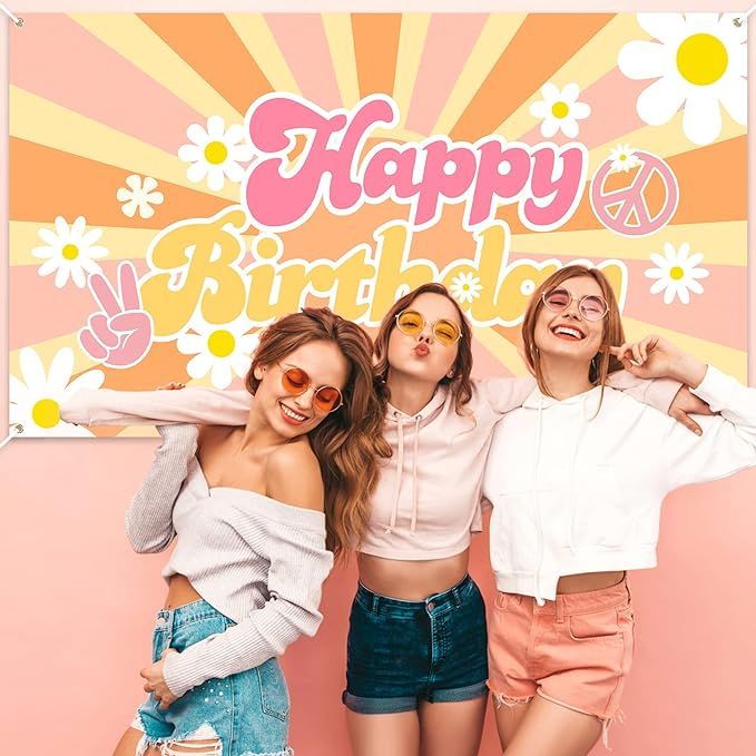 three girls are posing in front of a happy birthday sign