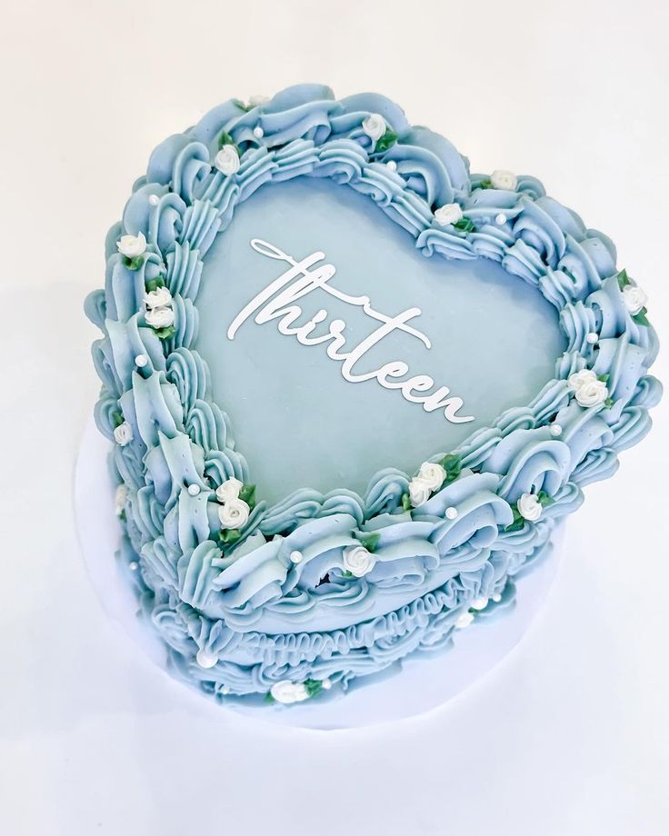 there is a heart shaped cake with the word tarteon written in frosting