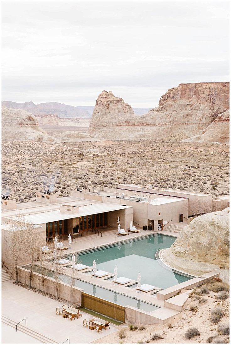 an outdoor swimming pool in the middle of desert