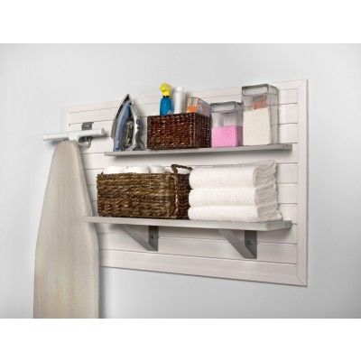 two shelves with towels and other items on them