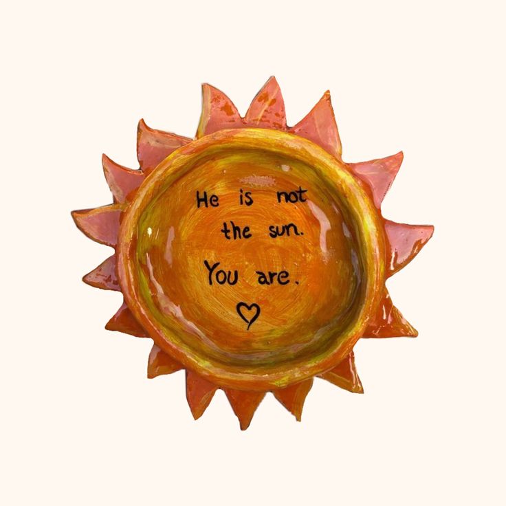 a ceramic sun with the words he is not the sun you are