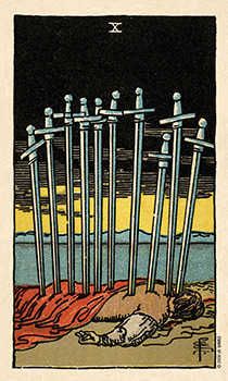 a tarot card with swords in the sand