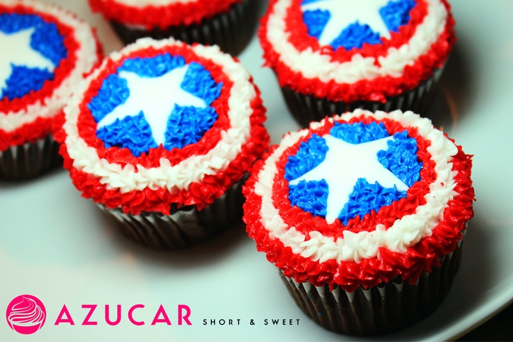 cupcakes decorated with red, white and blue icing are on a plate