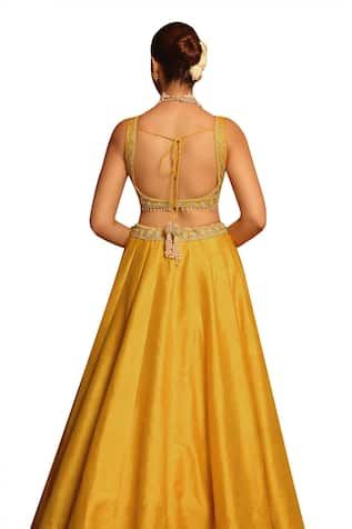 Mustard padded blouse with floral, dabka, zardozi, pearl, kirandori embroidery. Paired with an attached cancan lehenga with placement embroidery using similar work and dupatta with embroidered border. - Aza Fashions Fitted Gold Art Silk Gown, Fitted Gold Gown In Art Silk, Festive Lehenga With Fitted Bodice And Traditional Drape, Festive Reception Sets With Fitted Bodice, Festive Lehenga With Zari Work And Fitted Bodice, Traditional Silk Gown With Unstitched Blouse, Festive Lehenga With Fitted Bodice, Fitted Sleeveless Raw Silk Choli, Fitted Sleeveless Gown With Zari Work