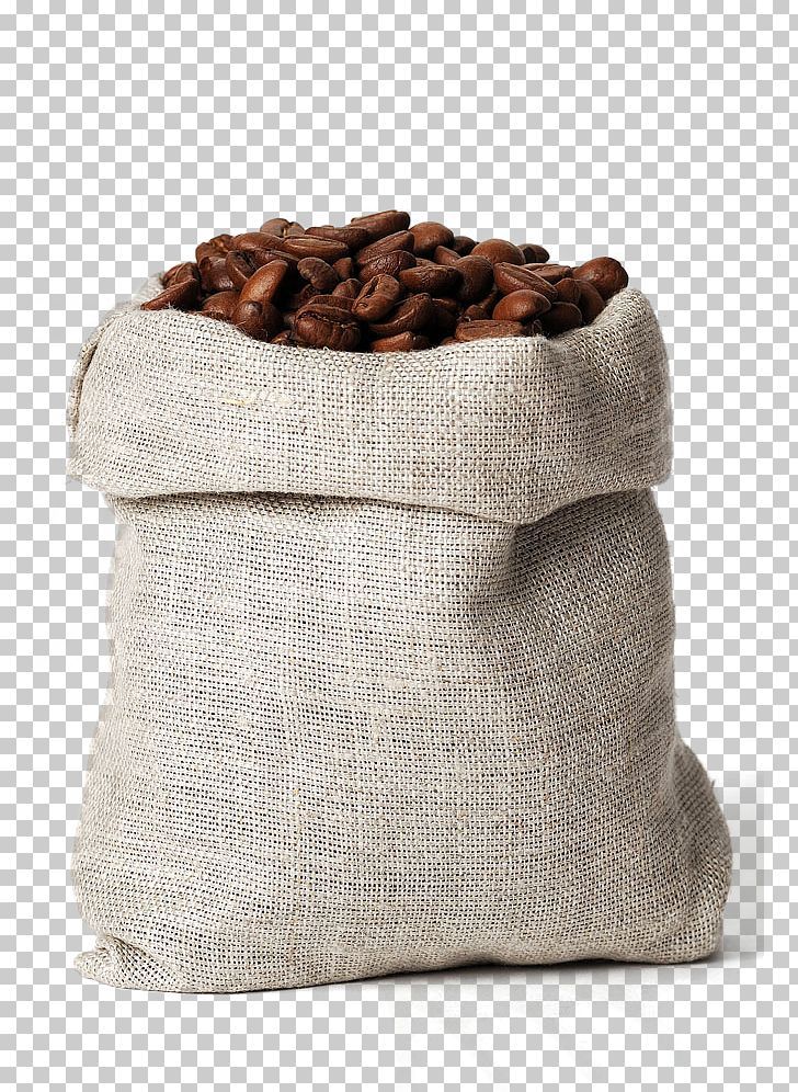 a bag filled with coffee beans sitting on top of a table