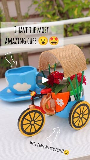 a small toy bike with flowers in the back